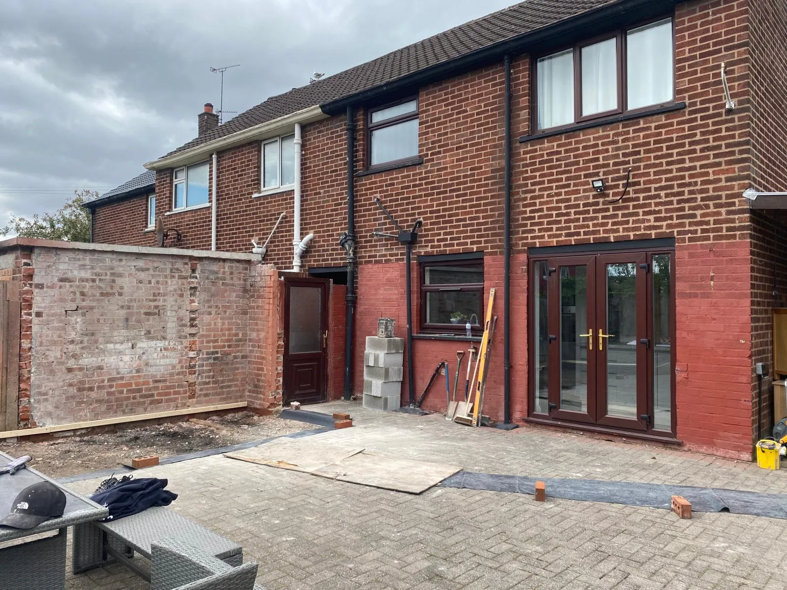 A house being built with a brick wall.