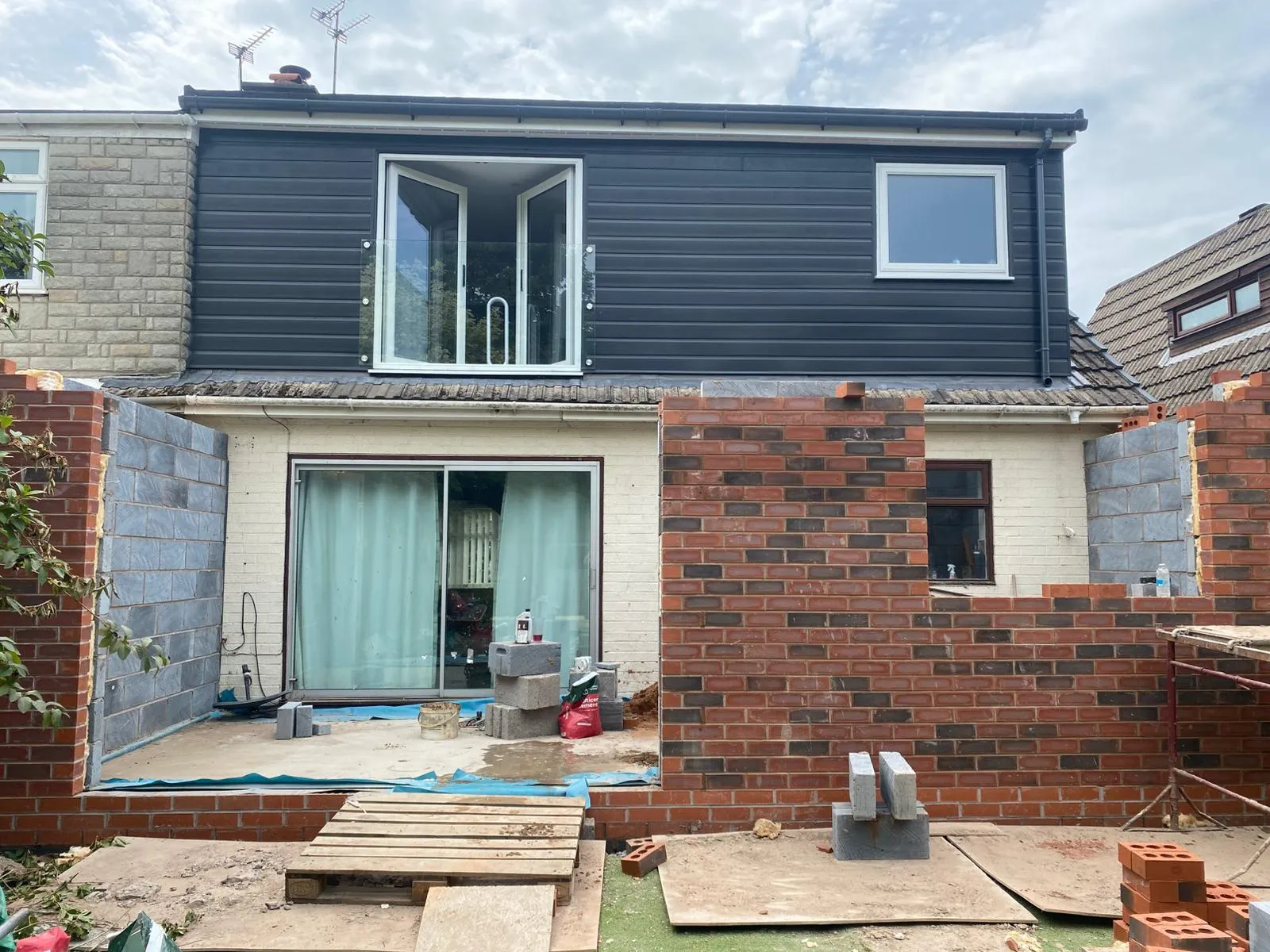 A house that is being built with brick.